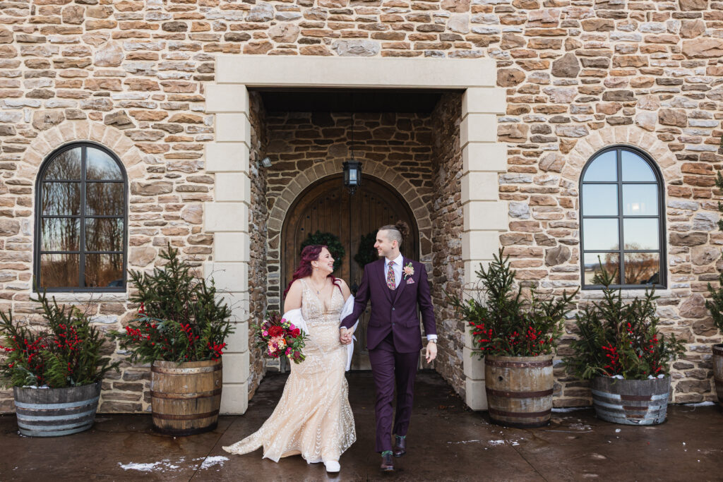 Bride and Groom walking in front of Folino Estate Weddings in Kutztown PA. Kutztown Wedding Photographer Good Omen Photo Co.